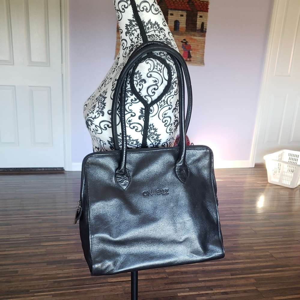 Vegan leather tote. Imported.